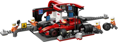 F1-pitstop og pitcrew med Ferrari-bil