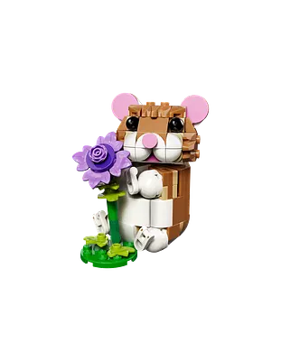Sød hamster med blomst